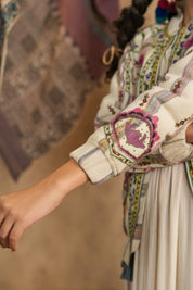 Cream Hand-Embroidered Bohemian Jacket – Multi-Color Threadwork, Tassel Detail, Relaxed Fit